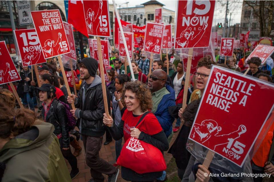 Protesters march for a $15 minimum wage