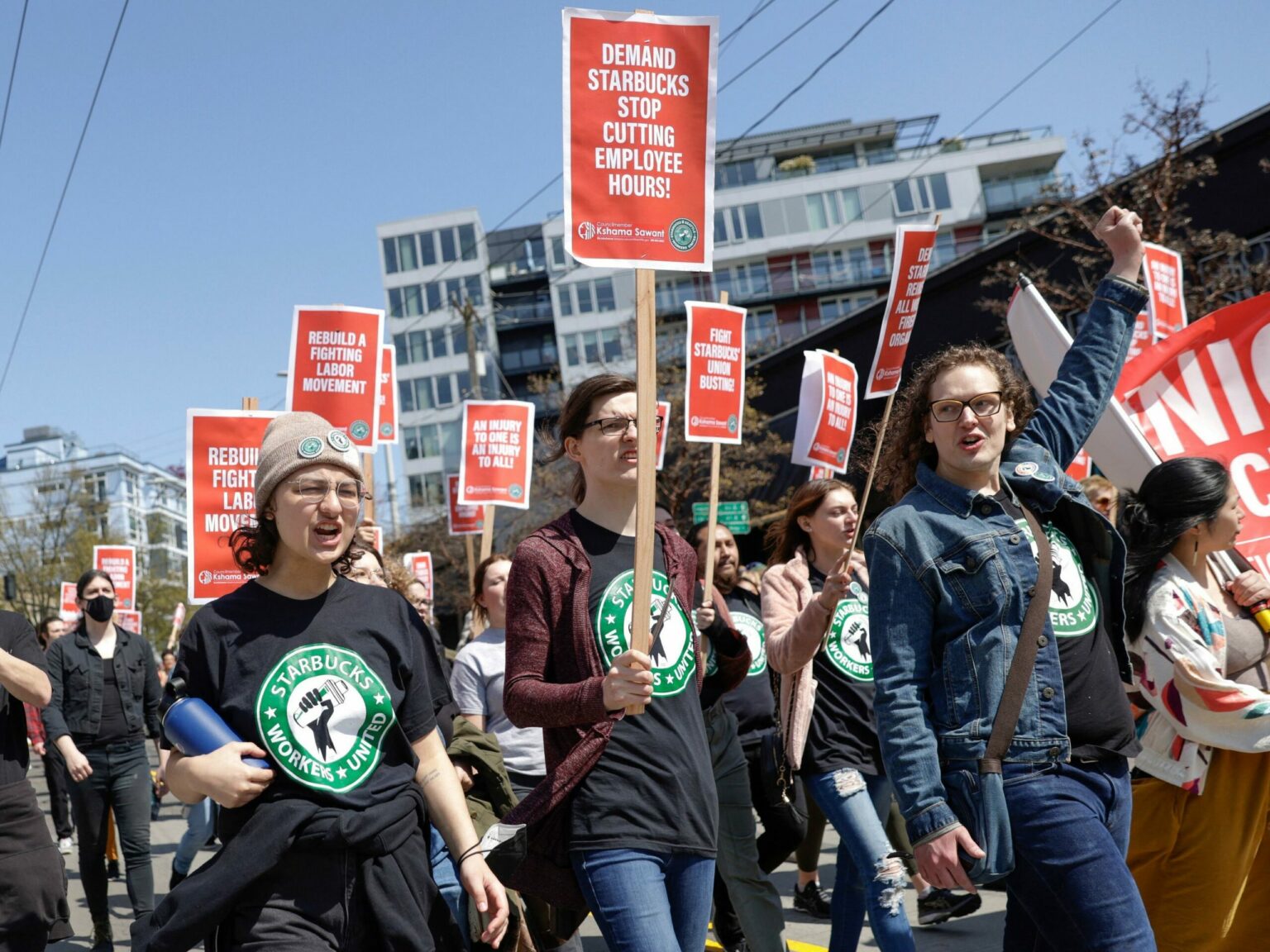 People marching in solidarity with Starbucks workers